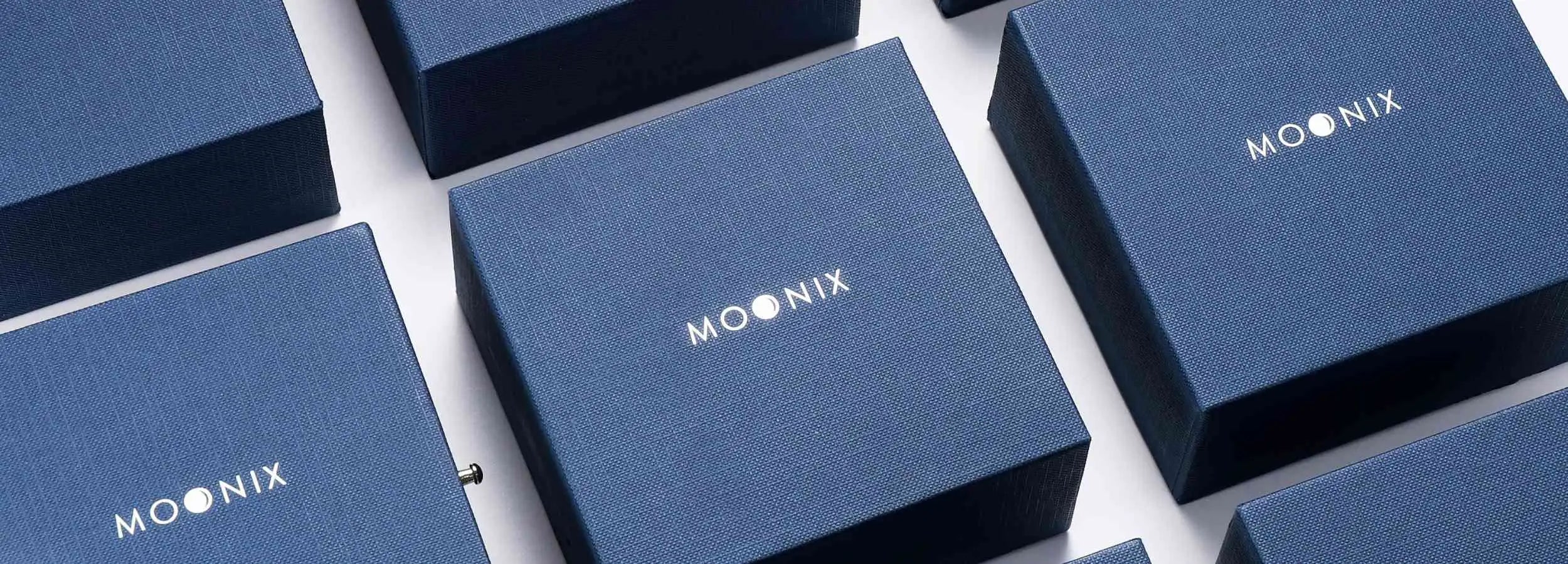 Deep blue textured boxes with the ’moonix’ logo in silver lettering.